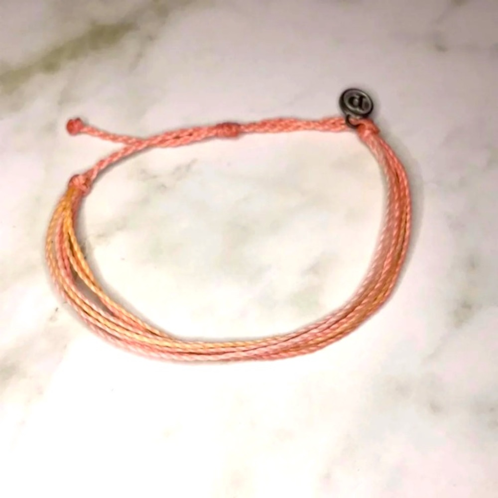 Pink string bracelet